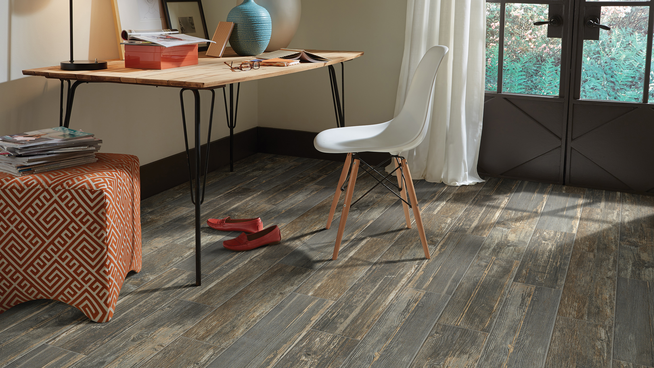 Wood-look tile flooring in a office, installation services available. 